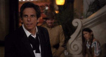 Movie still from “Night at the Museum: Secret of the Tomb” (2014), directed by Shawn Levy – Ben stiller in a suit and tie in front of another man in a suit; Close Up shot, Over the shoulder angle