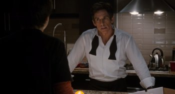 Movie still from “Night at the Museum: Secret of the Tomb” (2014), directed by Shawn Levy – A man in a white dress shirt and black bow tie is talking to another man in a white shirt and black bow tie in a kitchen; Medium shot, Over the shoulder angle