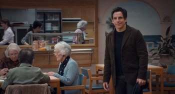 Movie still from “Night at the Museum: Secret of the Tomb” (2014), directed by Shawn Levy – A man standing next to an older woman in a room; Medium shot, Over the shoulder angle