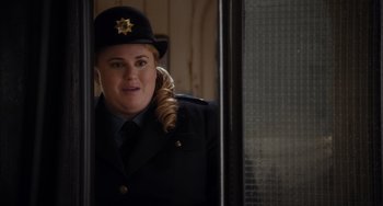 Movie still from “Night at the Museum: Secret of the Tomb” (2014), directed by Shawn Levy – A woman in a uniform is looking at the camera; Close Up shot, Over the shoulder angle