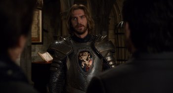 Movie still from “Night at the Museum: Secret of the Tomb” (2014), directed by Shawn Levy – A man wearing a suit of armor talking to someone; Medium shot, Over the shoulder angle