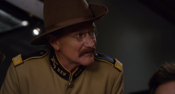 Movie still from “Night at the Museum: Secret of the Tomb” (2014), directed by Shawn Levy – A man in a uniform and a hat and eyeglasses; Close Up shot, Over the shoulder angle