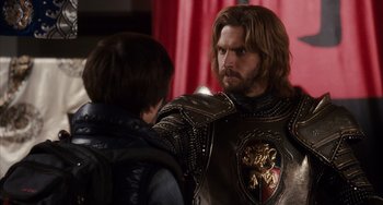 Movie still from “Night at the Museum: Secret of the Tomb” (2014), directed by Shawn Levy – A man with a beard is holding another man's arm; Close Up shot, Over the shoulder angle