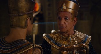 Movie still from “Night at the Museum: Secret of the Tomb” (2014), directed by Shawn Levy – A man in a gold and blue costume talking to another man in a gold and blue costume; Close Up shot, Over the shoulder angle