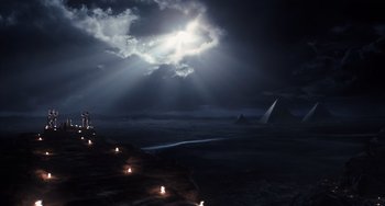 Movie still from “Night at the Museum: Secret of the Tomb” (2014), directed by Shawn Levy – Candles lit in front of a dark sky with clouds; Extreme Wide shot, High angle