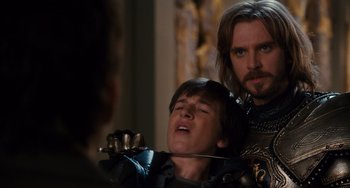 Movie still from “Night at the Museum: Secret of the Tomb” (2014), directed by Shawn Levy – Two men in medieval garb looking at each other; Close Up shot, Over the shoulder angle