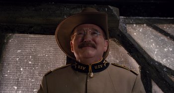 Movie still from “Night at the Museum: Secret of the Tomb” (2014), directed by Shawn Levy – A man in a military uniform wearing a hat and glasses; Close Up shot, Low angle