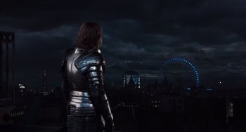 Movie still from “Night at the Museum: Secret of the Tomb” (2014), directed by Shawn Levy – A man in a suit of armor looking out over a city at night; Wide shot, Low angle