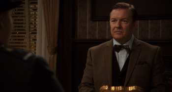 Movie still from “Night at the Museum: Secret of the Tomb” (2014), directed by Shawn Levy – A man wearing a suit and bow tie; Close Up shot, Over the shoulder angle