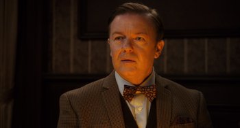Movie still from “Night at the Museum: Secret of the Tomb” (2014), directed by Shawn Levy – A person wearing a suit and a bow tie; Close Up shot, Over the shoulder angle