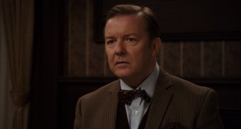 Movie still from “Night at the Museum: Secret of the Tomb” (2014), directed by Shawn Levy – A person wearing a suit and a bow tie; Close Up shot, Over the shoulder angle
