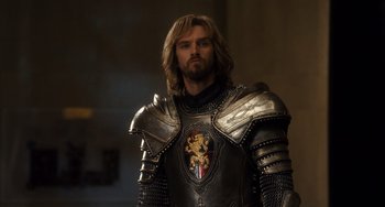 Movie still from “Night at the Museum: Secret of the Tomb” (2014), directed by Shawn Levy – A person wearing a suit of armor; Medium shot, Over the shoulder angle