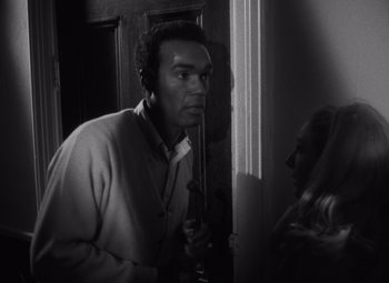 Movie still from “Night of the Living Dead” (1968), directed by George A. Romero – Medium shot, Over the shoulder angle