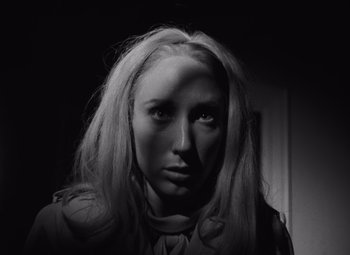 Movie still from “Night of the Living Dead” (1968), directed by George A. Romero – A black and white photo of a woman with long hair; Close Up shot, Low angle