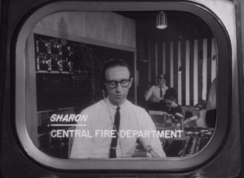 Movie still from “Night of the Living Dead” (1968), directed by George A. Romero – A black - and - white photo of a man in glasses; Close Up shot, Low angle