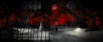 Movie still from “Nightbooks” (2021), directed by David Yarovesky – A woman standing next to a man near a fence; Extreme Wide shot, High angle