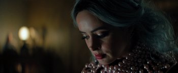 Movie still from “Nightbooks” (2021), directed by David Yarovesky – A person wearing a necklace; Close Up shot, Low angle