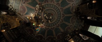 Movie still from “Nightbooks” (2021), directed by David Yarovesky – An aerial view of a building with a circular pattern; Extreme Wide shot, Overhead angle