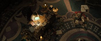 Movie still from “Nightbooks” (2021), directed by David Yarovesky – An overhead view of a room with many lamps and books; Extreme Wide shot, Overhead angle