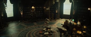 Movie still from “Nightbooks” (2021), directed by David Yarovesky – A room filled with lots of books on a floor; Wide shot, High angle