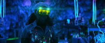 Movie still from “Nightbooks” (2021), directed by David Yarovesky – A person wearing goggles in a room; Medium shot, Low angle