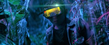 Movie still from “Nightbooks” (2021), directed by David Yarovesky – A man wearing a pair of goggles and a jacket; Close Up shot, Low angle