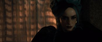 Movie still from “Nightbooks” (2021), directed by David Yarovesky – A person wearing a black dress; Close Up shot, Over the shoulder angle