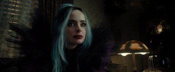 Movie still from “Nightbooks” (2021), directed by David Yarovesky – A person with long blue hair; Close Up shot, Over the shoulder angle