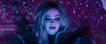 Movie still from “Nightbooks” (2021), directed by David Yarovesky – A person wearing a black shirt; Close Up shot, High angle