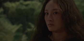 Movie still from “No Exit” (2022), directed by Damien Power – A person with long hair; Close Up shot, Over the shoulder angle