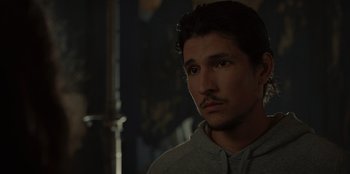 Movie still from “No Exit” (2022), directed by Damien Power – A person wearing a hoodie; Close Up shot, Over the shoulder angle