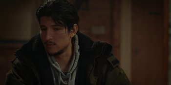 Movie still from “No Exit” (2022), directed by Damien Power – A person wearing a jacket; Close Up shot, Over the shoulder angle