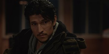 Movie still from “No Exit” (2022), directed by Damien Power – A person wearing a jacket; Close Up shot, Over the shoulder angle