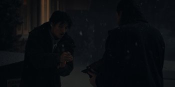 Movie still from “No Exit” (2022), directed by Damien Power – Two people in the dark talking to each other; Medium shot, Over the shoulder angle