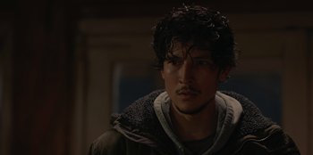 Movie still from “No Exit” (2022), directed by Damien Power – A person wearing a hooded jacket; Close Up shot, Over the shoulder angle