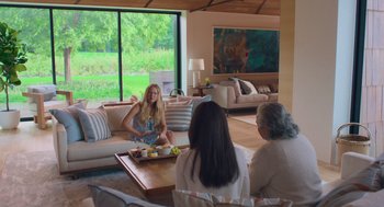 Movie still from “No Hard Feelings” (2023), directed by Gene Stupnitsky – A group of people sitting around a living room; Wide shot, Over the shoulder angle