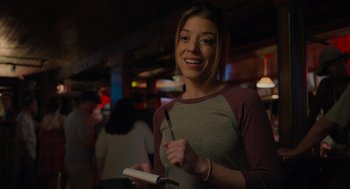 Movie still from “No Hard Feelings” (2023), directed by Gene Stupnitsky – A woman holding a wii controller in her hand; Close Up shot, Over the shoulder angle