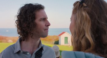 Movie still from “No Hard Feelings” (2023), directed by Gene Stupnitsky – A man and a woman looking at one another; Close Up shot, Over the shoulder angle