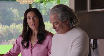 Movie still from “No Hard Feelings” (2023), directed by Gene Stupnitsky – A man and a woman standing next to each other; Medium shot, Over the shoulder angle