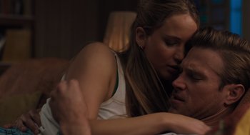 Movie still from “No Hard Feelings” (2023), directed by Gene Stupnitsky – A man and a woman laying in bed together; Close Up shot, High angle