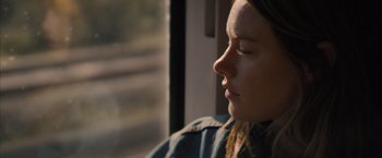 Movie still from “No Limit” (2022), directed by David M. Rosenthal – A person looking out a window; Close Up shot, Over the shoulder angle