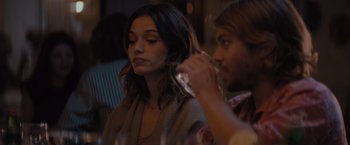 Movie still from “No Limit” (2022), directed by David M. Rosenthal – A woman getting her hair done by a man; Close Up shot, Over the shoulder angle
