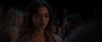 Movie still from “No Limit” (2022), directed by David M. Rosenthal – A beautiful young woman with long dark hair; Close Up shot, Over the shoulder angle