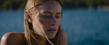 Movie still from “No Limit” (2022), directed by David M. Rosenthal – A person with long brown hair; Close Up shot, High angle