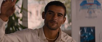 Movie still from “No Limit” (2022), directed by David M. Rosenthal – A person wearing a white shirt; Close Up shot, Over the shoulder angle