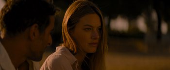 Movie still from “No Limit” (2022), directed by David M. Rosenthal – A beautiful young woman with long , brown hair; Close Up shot, Over the shoulder angle