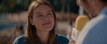 Movie still from “No Limit” (2022), directed by David M. Rosenthal – A person smiling; Close Up shot, Over the shoulder angle