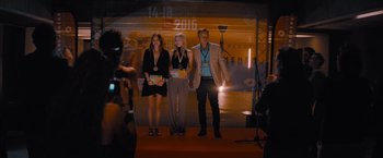 Movie still from “No Limit” (2022), directed by David M. Rosenthal – A group of people standing on a red carpet; Wide shot, Over the shoulder angle