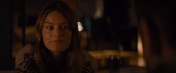 Movie still from “No Limit” (2022), directed by David M. Rosenthal – A person sitting at a table; Close Up shot, Over the shoulder angle