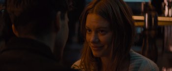 Movie still from “No Limit” (2022), directed by David M. Rosenthal – A person with long red hair; Close Up shot, Over the shoulder angle